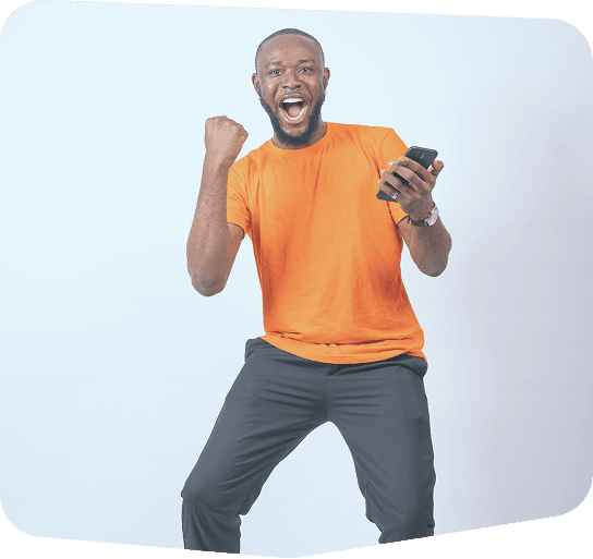 Excited man celebrating with phone